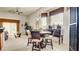 Cozy dining area with a marble table, comfortable chairs, and natural light at 711 Golden Sedum Dr, Henderson, NV 89011