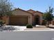 Charming single-story home with a well-manicured lawn and a two-car garage at 711 Golden Sedum Dr, Henderson, NV 89011