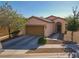 Charming single-story home with a two-car garage and low-maintenance desert landscaping at 711 Golden Sedum Dr, Henderson, NV 89011