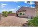 Private backyard features low-maintenance desert landscaping and a covered patio, perfect for outdoor relaxation and entertaining at 7152 Fairwind Acres Pl, Las Vegas, NV 89131