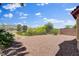 Backyard with desert landscaping, a low brick wall, and mountain views at 7152 Fairwind Acres Pl, Las Vegas, NV 89131
