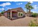 A cozy home backyard offers privacy and outdoor enjoyment, highlighted by a covered patio and desert landscaping at 7152 Fairwind Acres Pl, Las Vegas, NV 89131