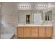 Bright bathroom features a walk-in shower and a double sink vanity at 7152 Fairwind Acres Pl, Las Vegas, NV 89131