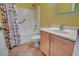 Bathroom showcasing a light wood vanity and a shower with leaf-patterned curtain at 7152 Fairwind Acres Pl, Las Vegas, NV 89131
