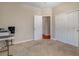 Bedroom with neutral carpet, walk in closet, and a doorway to another room at 7152 Fairwind Acres Pl, Las Vegas, NV 89131