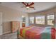 Bright bedroom features three large windows with backyard views at 7152 Fairwind Acres Pl, Las Vegas, NV 89131