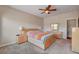 Bright bedroom features wood-look ceiling fan at 7152 Fairwind Acres Pl, Las Vegas, NV 89131