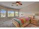 Bright bedroom features backyard views from the windows at 7152 Fairwind Acres Pl, Las Vegas, NV 89131