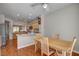 Bright dining area features a ceiling fan and is adjacent to the kitchen at 7152 Fairwind Acres Pl, Las Vegas, NV 89131