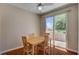 Bright dining area features a sliding glass door to the backyard at 7152 Fairwind Acres Pl, Las Vegas, NV 89131