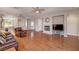 Bright living area with wood floors and an open layout leading to the kitchen and dining at 7152 Fairwind Acres Pl, Las Vegas, NV 89131
