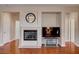 Cozy living space with a fireplace and built-in shelving, perfect for relaxing and entertaining at 7152 Fairwind Acres Pl, Las Vegas, NV 89131