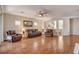 Inviting living area with hardwood floors, comfortable seating, and plenty of natural light at 7152 Fairwind Acres Pl, Las Vegas, NV 89131