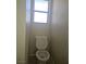 Cozy bathroom featuring a toilet with a window at 7300 Pirates Cove Rd # 2025, Las Vegas, NV 89145