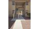 Exterior entrance to a condo building with a staircase leading to upper units with rock landscaping at 7300 Pirates Cove Rd # 2025, Las Vegas, NV 89145