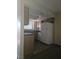 Kitchen featuring tile floors, oak cabinets, a white refrigerator, dishwasher, and granite countertops at 7300 Pirates Cove Rd # 2025, Las Vegas, NV 89145