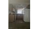 Kitchen featuring tile floors, oak cabinets, a white refrigerator, dishwasher, stove, and granite countertops at 7300 Pirates Cove Rd # 2025, Las Vegas, NV 89145