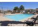 Community pool with lounge chairs offers a relaxing outdoor space at 7300 Pirates Cove Rd # 2025, Las Vegas, NV 89145