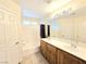 Bathroom featuring a double sink vanity, shower/tub combo, and neutral color scheme at 7319 Burnt Umber St, Las Vegas, NV 89139
