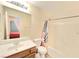 Neutral bathroom featuring a shower-tub combo, wooden vanity, and mirrored wall cabinet at 7319 Burnt Umber St, Las Vegas, NV 89139