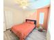 Cozy bedroom with color block wall, ceiling fan and gray wood-look flooring at 7319 Burnt Umber St, Las Vegas, NV 89139