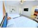 Spacious bedroom showcasing two beds, a bathroom entrance, and access to the bedroom at 7319 Burnt Umber St, Las Vegas, NV 89139