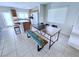 Inviting dining area with access to the kitchen featuring tiled floors and neutral paint at 7319 Burnt Umber St, Las Vegas, NV 89139
