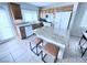 Charming kitchen with stainless appliances, breakfast bar, granite countertops, and ample cabinet space at 7319 Burnt Umber St, Las Vegas, NV 89139