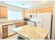 Functional kitchen with island, modern appliances, granite countertops and ample cabinet space at 7319 Burnt Umber St, Las Vegas, NV 89139