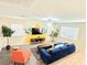 Inviting living space featuring tropical-themed accents, hardwood floors and bright, airy atmosphere at 7319 Burnt Umber St, Las Vegas, NV 89139