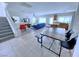 Open living space showcasing the staircase, dining area, and living room, ideal for Gathering gatherings at 7319 Burnt Umber St, Las Vegas, NV 89139