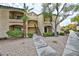 Inviting two-story building with a tan facade, complemented by lush greenery and a well-maintained landscape at 7885 W Flamingo Rd # 1016, Las Vegas, NV 89147