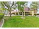 Clubhouse and picnic area amidst lush landscaping and mature trees, offering a perfect spot for outdoor enjoyment at 7885 W Flamingo Rd # 1016, Las Vegas, NV 89147