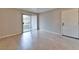 Open living area features tiled floors, balcony access, and a bright atmosphere ideal for relaxation at 7885 W Flamingo Rd # 1016, Las Vegas, NV 89147