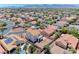 Wide angle aerial view of a neighborhood filled with single-Gathering homes on a sunny day at 7892 Villa Salsa Ave, Las Vegas, NV 89131