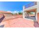 Spacious backyard featuring gravel landscaping and a covered patio, perfect for outdoor activities and relaxation at 7892 Villa Salsa Ave, Las Vegas, NV 89131