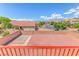 Backyard with brick walls, loose stones, and a view of neighborhood homes at 7892 Villa Salsa Ave, Las Vegas, NV 89131