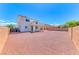 Large backyard with gravel, block wall, and open space providing ample room for recreation and landscaping at 7892 Villa Salsa Ave, Las Vegas, NV 89131
