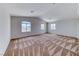 Spacious bedroom with three windows and patterned carpeting at 7892 Villa Salsa Ave, Las Vegas, NV 89131