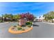 Community entrance with stone signage amidst lush landscaping, offering a welcoming and prestigious first impression at 7892 Villa Salsa Ave, Las Vegas, NV 89131
