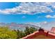 Distant mountain view from a house with some green trees at 7892 Villa Salsa Ave, Las Vegas, NV 89131