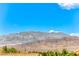Scenic mountain view with trees and tile roofed homes at 7892 Villa Salsa Ave, Las Vegas, NV 89131
