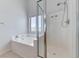 Bathroom with a shower and a separate soaking tub, offering options for relaxation at 7892 Villa Salsa Ave, Las Vegas, NV 89131