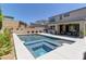 Beautiful backyard with pool, spa, and covered patio area perfect for entertaining at 8335 Beaten Path Ct, Las Vegas, NV 89166