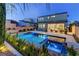 Spacious backyard with a pool, spa, covered patio and stylish outdoor seating, perfect for entertaining at 8335 Beaten Path Ct, Las Vegas, NV 89166