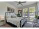 Cozy bedroom with natural light from large windows, comfortable furnishings, and stylish decor at 8335 Beaten Path Ct, Las Vegas, NV 89166