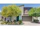 Attractive two-story home showcasing manicured landscaping and a convenient two-car garage at 8335 Beaten Path Ct, Las Vegas, NV 89166
