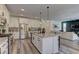 Modern kitchen with white cabinets, stainless steel appliances, and a center island perfect for entertaining at 8335 Beaten Path Ct, Las Vegas, NV 89166