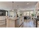 Bright kitchen featuring granite counters, stainless appliances, and a kitchen island with pendant lighting at 8335 Beaten Path Ct, Las Vegas, NV 89166