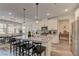Bright kitchen featuring a large center island, stainless steel appliances, and stylish pendant lighting at 8335 Beaten Path Ct, Las Vegas, NV 89166